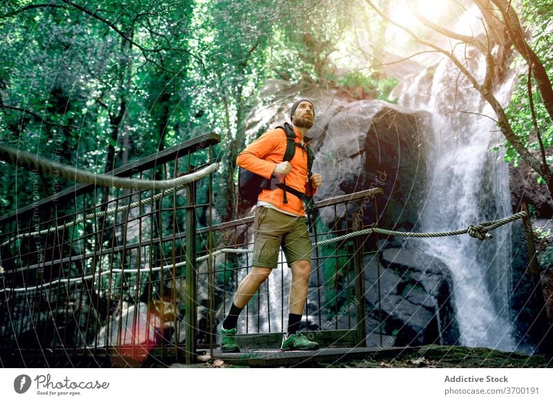 Travel Man On Bridge Over Beautiful Forest River by Stocksy Contributor  Aila Images - Stocksy