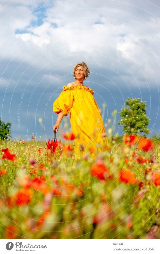 Woman with umbrella on flower meadow Poppy Umbrellas & Shades Laughter Young woman Poppy field Meadow Flower meadow stroll fortunate cheerful time-out luck Joy