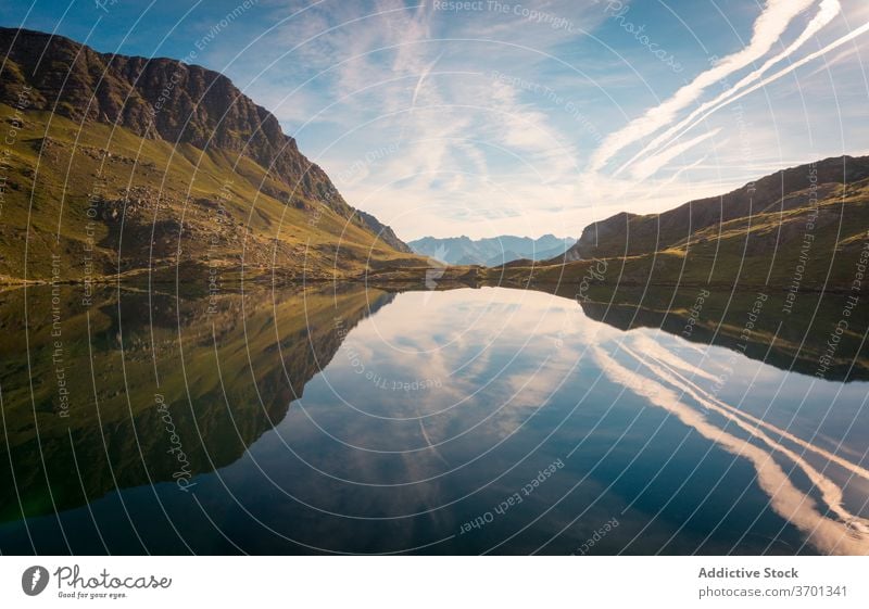 Amazing view of mountainous terrain with lake landscape ridge rocky scenery breathtaking water serene peaceful calm summer nature sky idyllic tranquil majestic