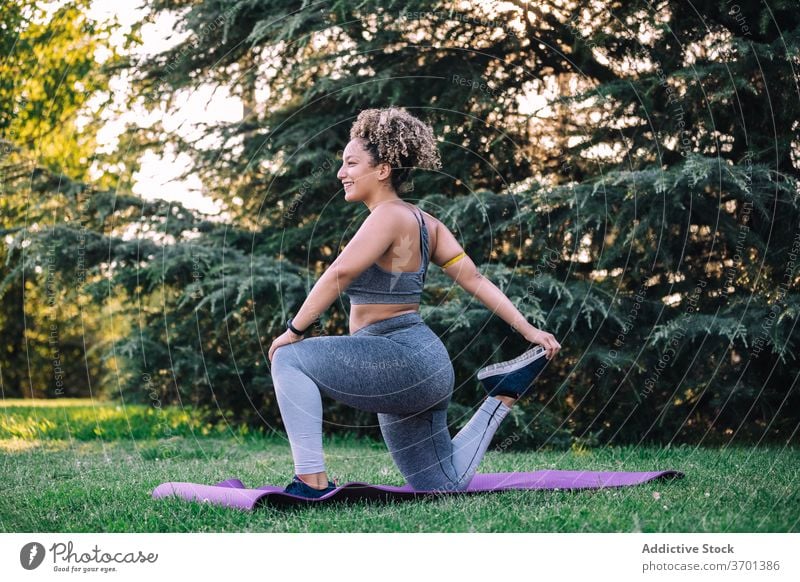 Free Photo  Fitness girl doing leg workout on yoga mat at outdoor