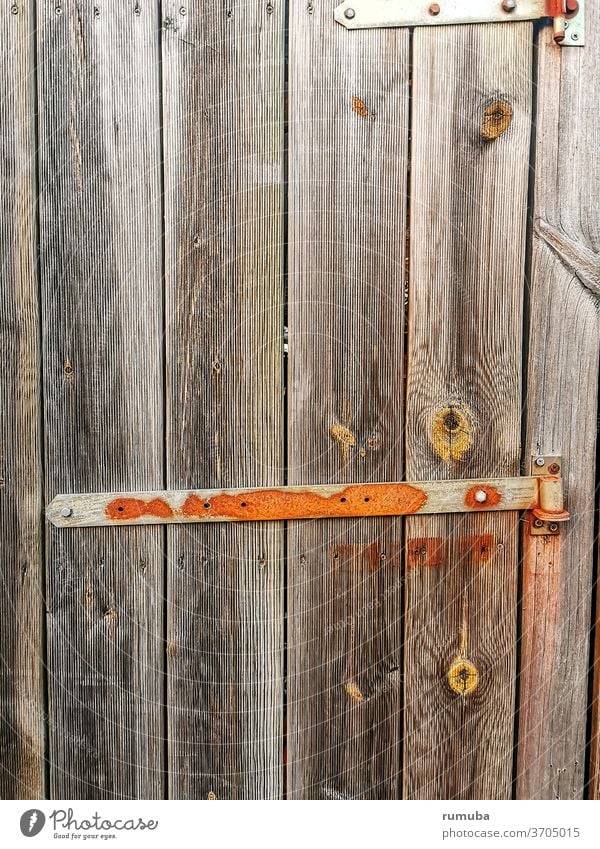 Old wooden door with metal lock Goal locked Closed Entrance Front door Door handle Lock Structures and shapes Wooden door Safety Wooden gate Main gate cast-iron