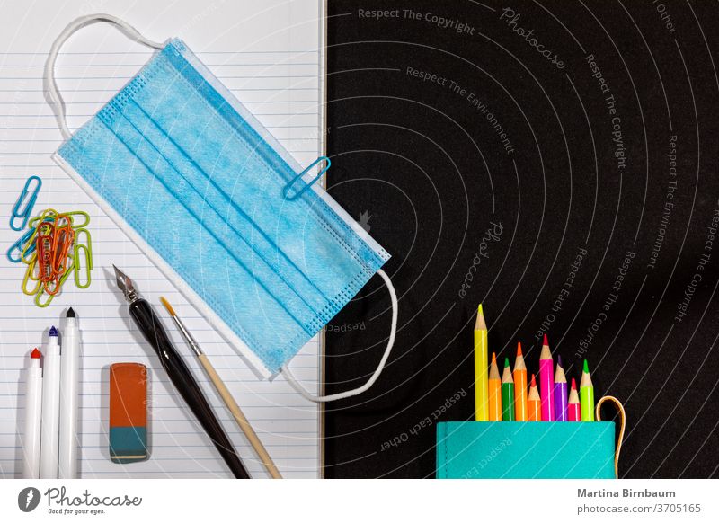 Back to school in 2020. Staying safe with a face mask  as an additional accessory for school chalkboard crayon studying crayons pandemic covid-19 back to school