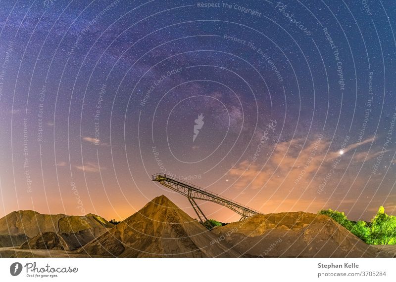 Conveyor bridge at night and Milky Way, observation of the stars on a construction site. Milky way Construction Astrophotography Conveyor belt background Stars