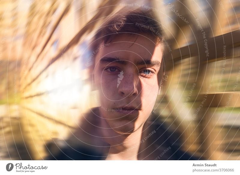 Portrait of a serious young man with dynamic background portrait beautiful handsome speed motion blur sunlight flare lines perspective powerful confident