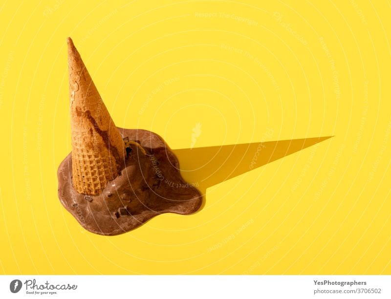 Chocolate ice cream in waffle cone upside down. Dropped ice cream abstract accident background bright brown childhood chocolate chocolate ice cream close-up
