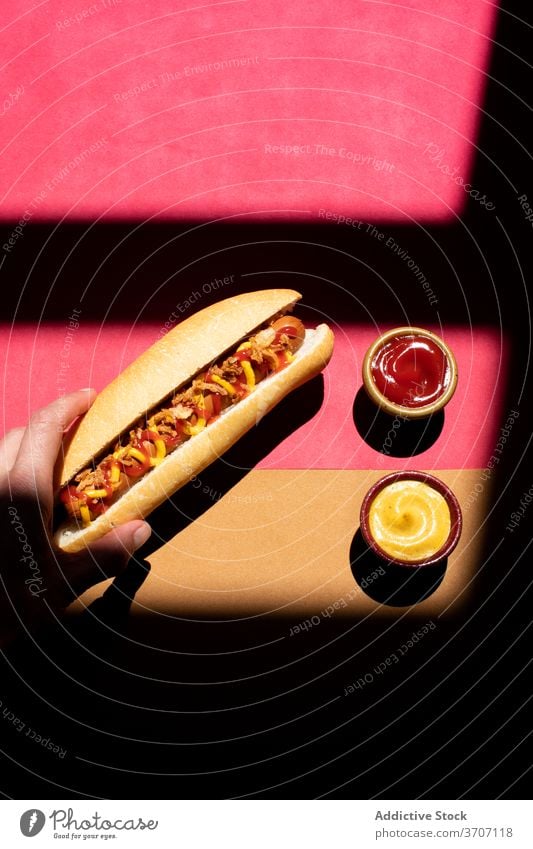Frankfurt hot dog with mustard and ketchup closeup culinary zigzag sandwich weiner background frankfurter sausage snack lunch bun american food dinner grilled