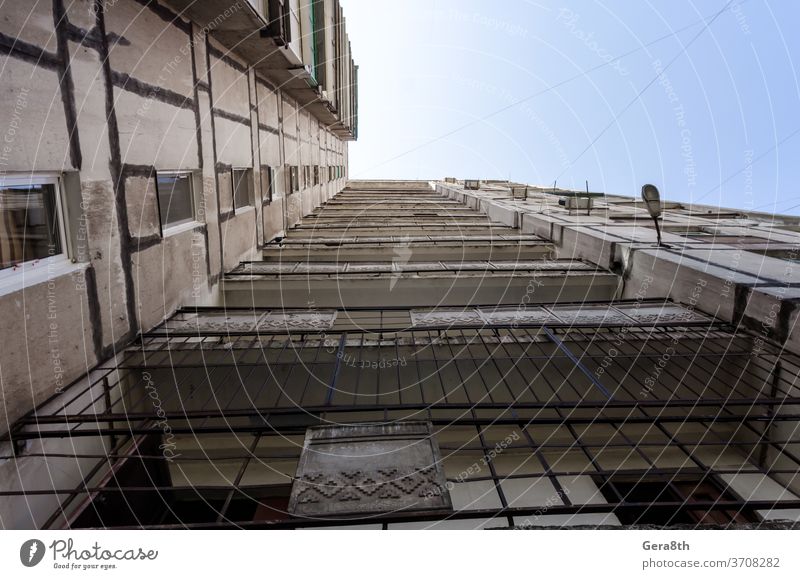 old gray high building in Uraine Donbass Dobnbass Soviet Ukraine abandoned abstract architecture area background black blue bottom view city conflict