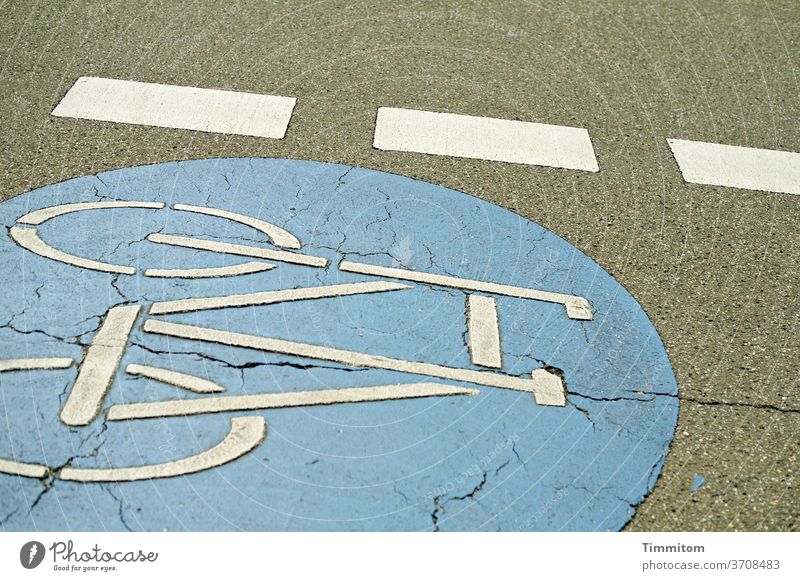 Unconventional road marking in a slight inclined position Lane markings Signs and labeling Signage Bicycle bicycle lane demarcation Colour areas of colour Gray