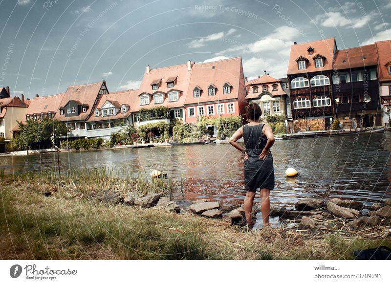 Holiday in Little Venice Bamberg Old town Regnitz river River Woman River bank Summer vacation Housefront