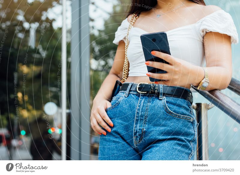 unrecognizable woman writing a message on her smartphone technology communication mobile phone reading young female cellphone using texting hand working sms