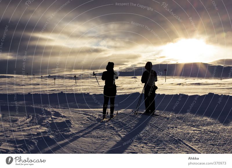 Two people in the sun before an evening winter landscape Exotic Harmonious Well-being Calm Adventure Freedom Expedition Winter Snow Mountain Nature Landscape