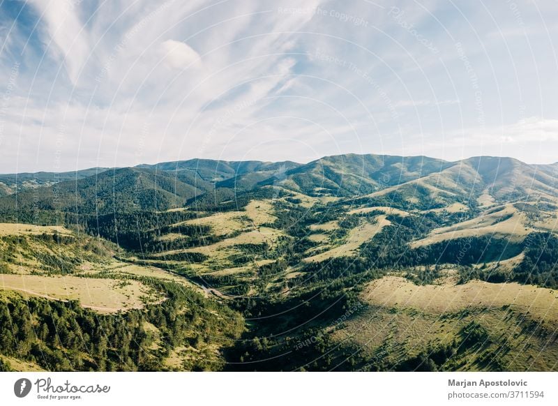 Aerial view of a beautiful mountain range of Zlatibor, Serbia above aerial background cloud clouds environment europe forest grass green high hike hiking hill