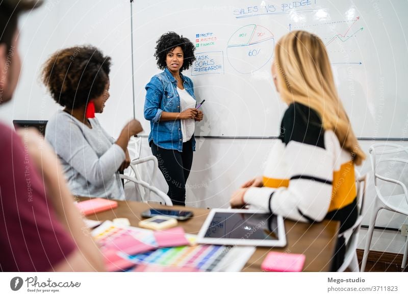 Manager woman leading a brainstorming meeting. planning business manager research employee occupation cooperation conference leadership professional