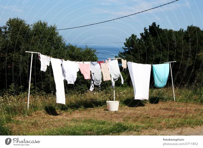 Clothes line outdoors in a backyard - a Royalty Free Stock Photo