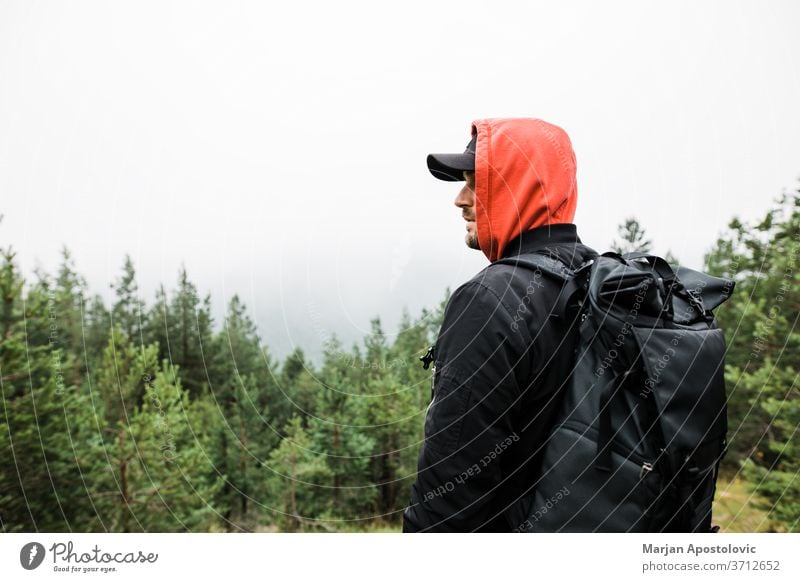 Woman with backpack hiking in mountains, spending summer vacation close to  nature - a Royalty Free Stock Photo from Photocase