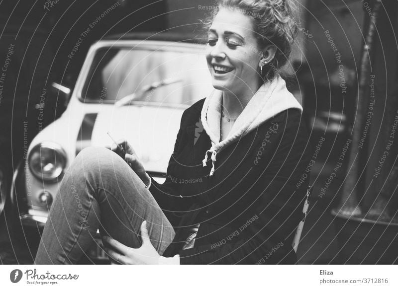 Portrait of a laughing young woman with closed eyes Laughter Joy Woman youthful Vintage car Sit omitted girl Happiness luck Lifestyle portrait smile Closed eyes