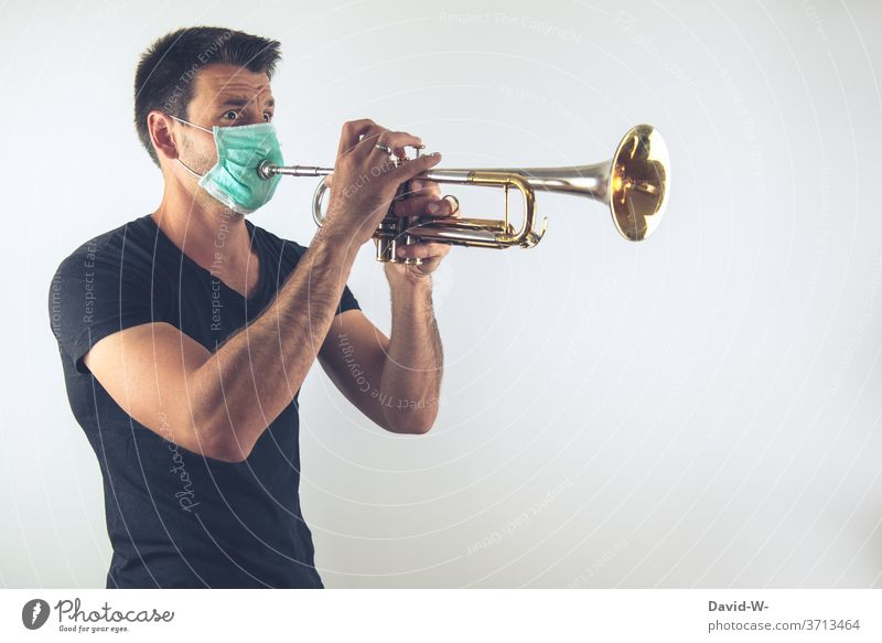 Making music in times of Corona corona coronavirus Musician Wind instrument Respirator mask Mask breathing mask pandemic Virus Healthy Infection Quarantine