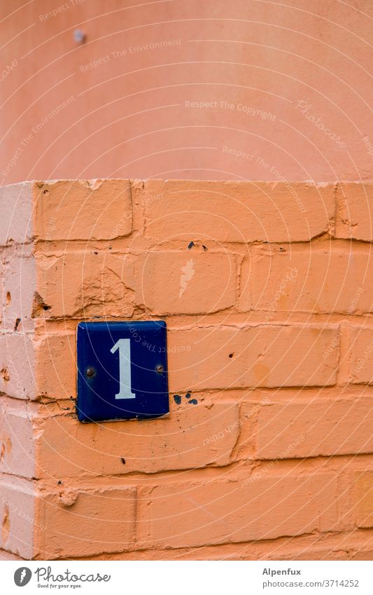Entry post 1 Digits and numbers Signs and labeling House number Wall (building) Exterior shot Deserted Colour photo Wall (barrier) Facade Day Characters