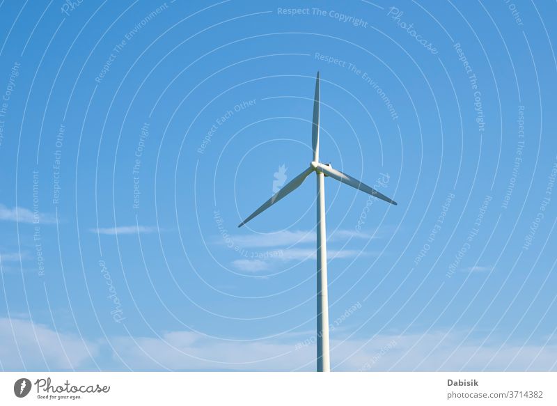 Wind turbine against blue sky. Wind power energy concept wind generator industry electricity alternative clean renewable environment technology wind turbine