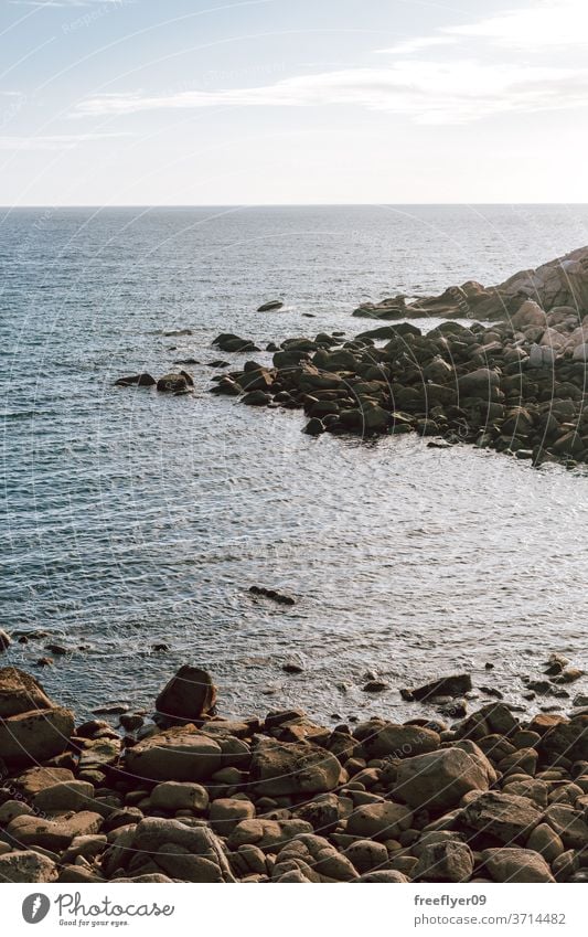 Ocean coast made of large stones and rocks ocean sea nobody copy space horizon scene clean shore coastline breakwater rocky seashore landscape fresh scenic