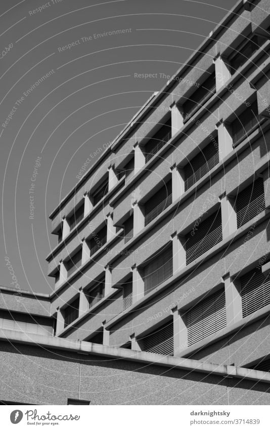 Concrete architecture in black and white Architecture built office brutalism Planning Build Redevelop Facade Window Grid