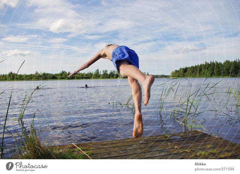 Young man jumps into a lake, summer frog's perspective Swimming & Bathing Freedom Summer Sun Human being Life Nature Elements Water Sky Clouds Sunlight