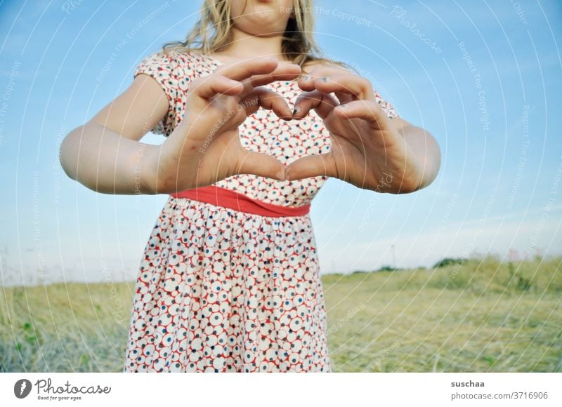 girl holds a heart out of her hands Child Dress Summer Summery Fingers Heart heartfelt formed dear Love by hand Emotions Infancy Declaration of love With love