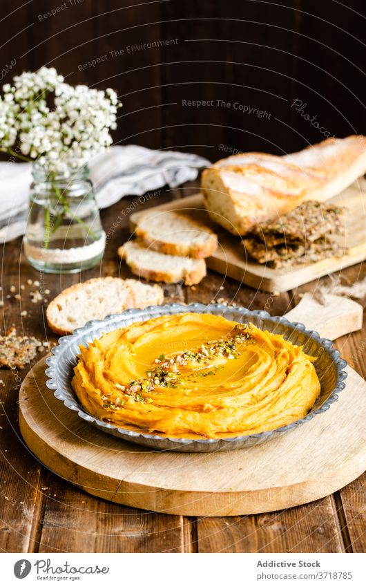 Tasty hummus in plate on table delicious potato dish sweet tradition appetizing wooden kitchen bread lunch food meal organic fresh rustic ingredient natural