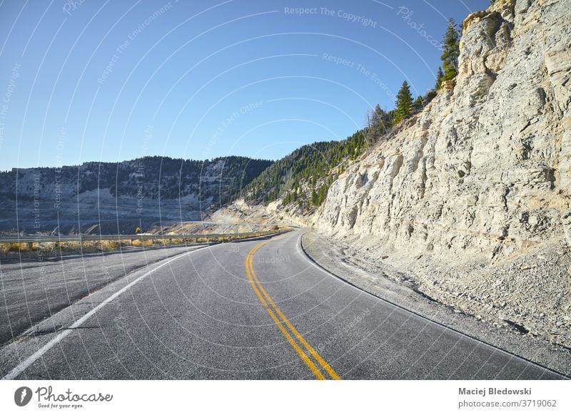 Scenic road, travel concept. trip summer Colorado mountains filtered highway marking lanes adventure journey road trip landscape nature USA wanderlust canyon