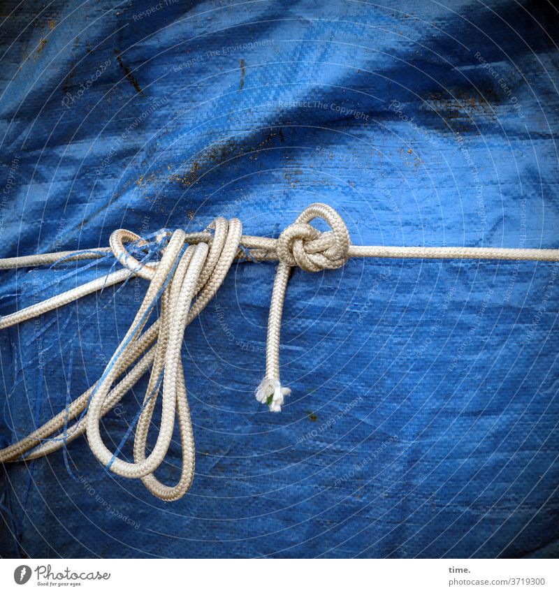 Interfaces of everyday life (11) tarpaulin cord Band Knot Blue White Attachment Bound tie Loop Trashy Wrinkles Folds plump Rope Dew Plastic
