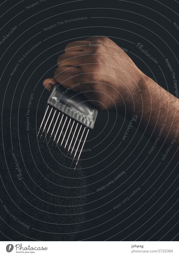 Black Man using Comb Pick pick comb blm Black Lives Matter Using Comb hair care Hair and hairstyles Black Hair hair dress hair dresser Adults Black Adult