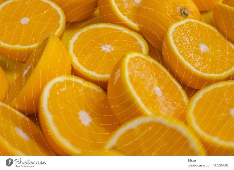 Halved oranges, which are immediately pressed into delicious fresh orange juice Orange juice juicy oranges Fresh halved Halves cute Juice Fruity salubriously