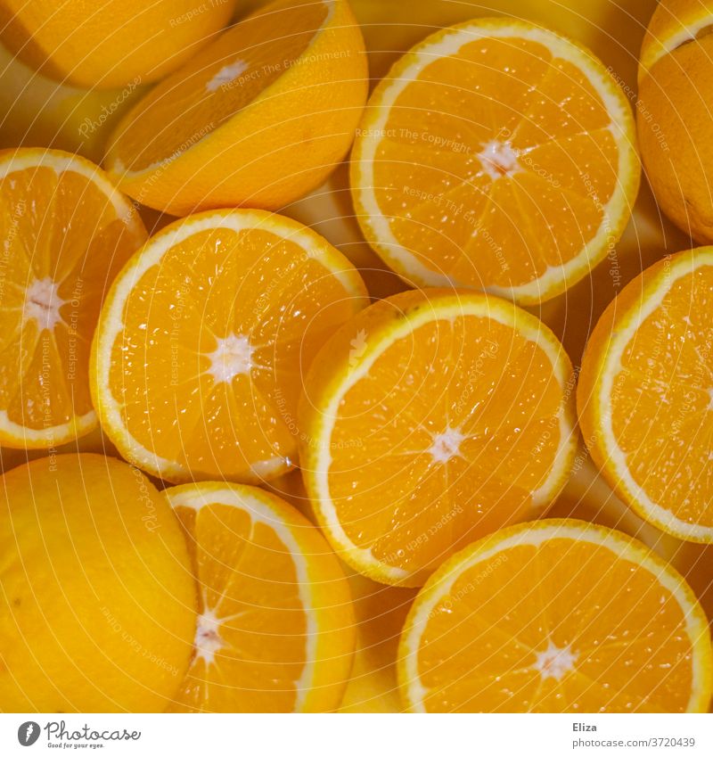 Halved oranges, which are immediately pressed into delicious fresh orange juice Orange juice juicy oranges Fresh halved Halves Sweet Juice Fruity salubriously