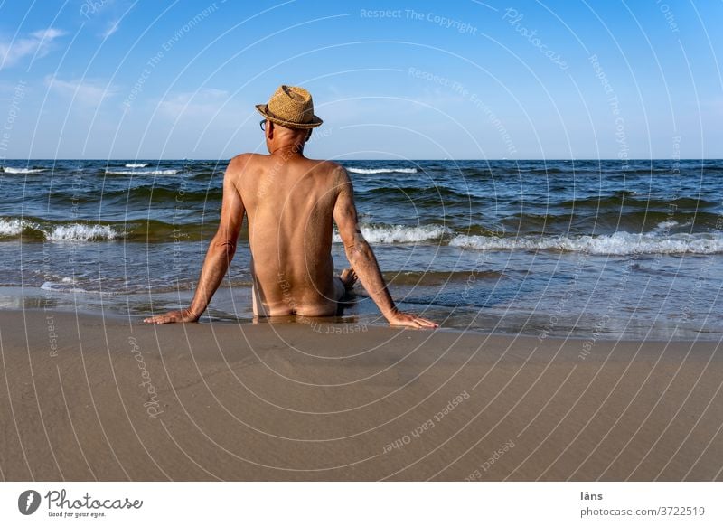 Man sitting at the sea Beach Ocean Human being Sand Summer Vacation & Travel Baltic Sea Tourism Relaxation Naked NUDISM on one's own Summer vacation coast