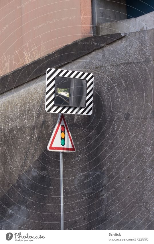 Traffic mirror and traffic sign Traffic light in front of concrete wall of an underpass traffic mirrors Traffic sign traffic light Road sign Mirror