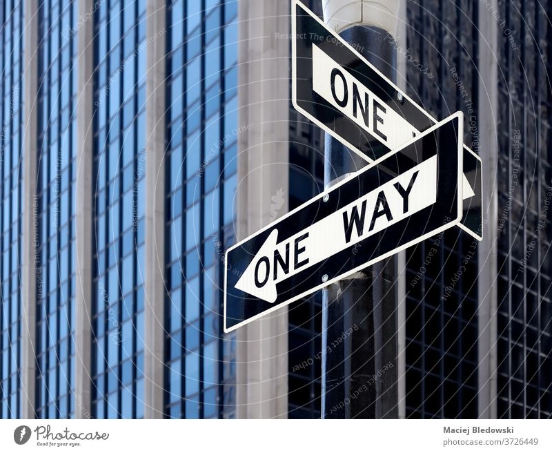 One way street traffic signs in New York City, USA. new york city manhattan one way us road urban direction concept choice arrow decision black white building