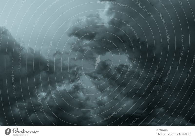 Dark dramatic sky and clouds. Background for death and sad concept. Gray sky and fluffy white clouds. Thunder and storm sky. Sad and moody sky. Nature background. Dead abstract background. Cloudscape.