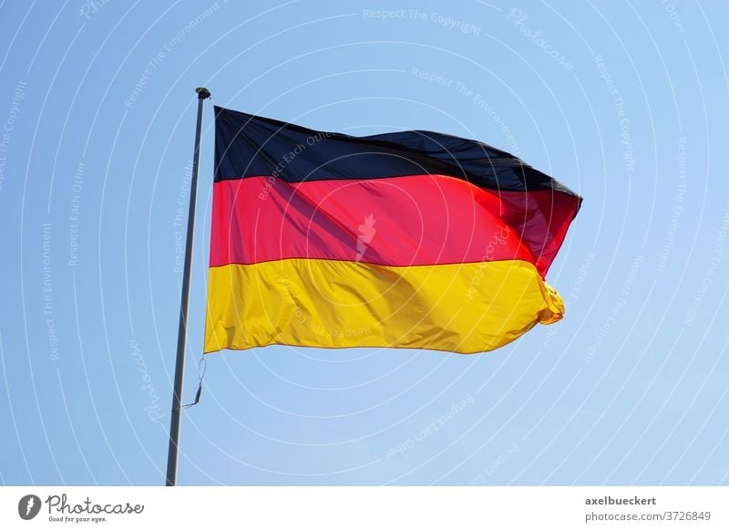 Germany flag black red gold blowing on the flagpole - a Royalty Free Stock  Photo from Photocase