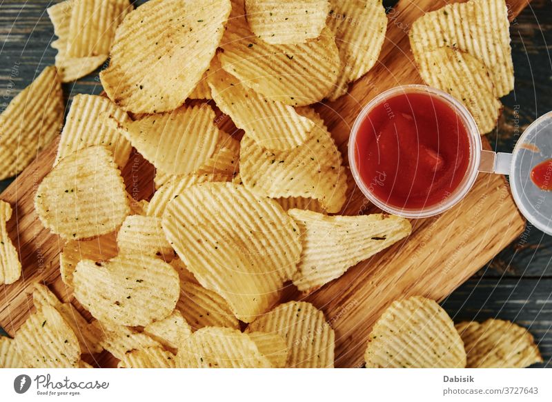 Potato chips and sauce on the table, close up junk unhealthy food calories clipping crisp crispy crunchy delicious fast fat flat fried potato background eat