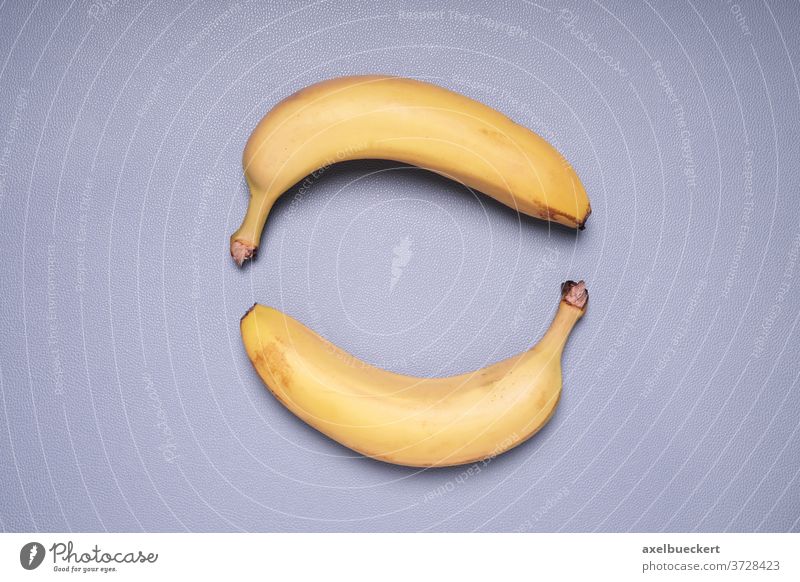 two bananas forming circle shape fruit food topview top view above overhead yellow healthy ripe sweet nobody snack vitamin nutrition diet organic object