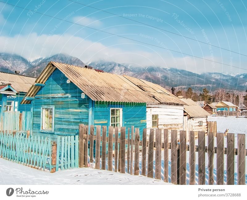 wooden house at the foot of the mountains, wild life, winter background.  village. architecture beautiful blue cold europe frost vintage travel landscape nature