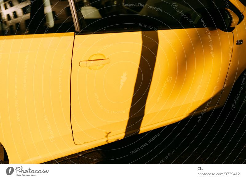 yellow car Yellow Vehicle Abstract Structures and shapes Car door Means of transport Reflection Detail Colour photo door handle Car Window Shadow abstraction