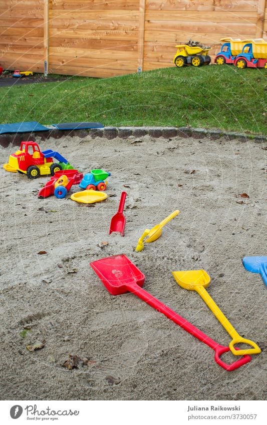 Toys in the sandbox Sandpit Playing Exterior shot Colour photo Child Joy Infancy Kindergarten Day Toddler Children's game Leisure and hobbies Parenting