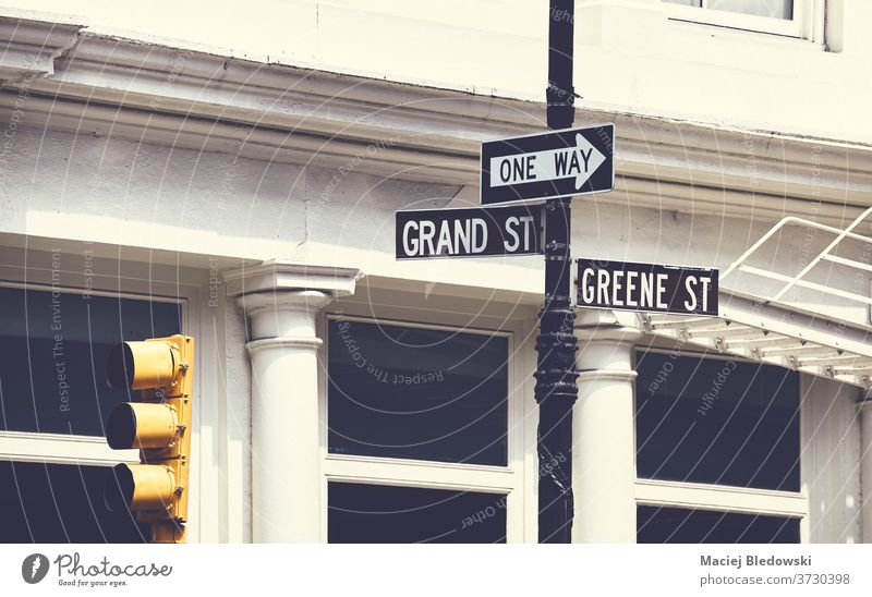 Grand and Greene Street signs in New York City, USA. city street traffic light Manhattan one way Grand Street retro vintage urban United States NYC new york
