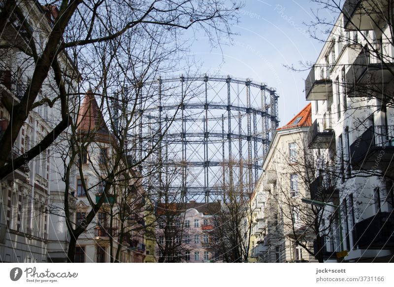 Gasometer in Schöneberg Architecture Landmark Historic Facade Housefront Residential area Cloudless sky bare trees Telescopic gas container