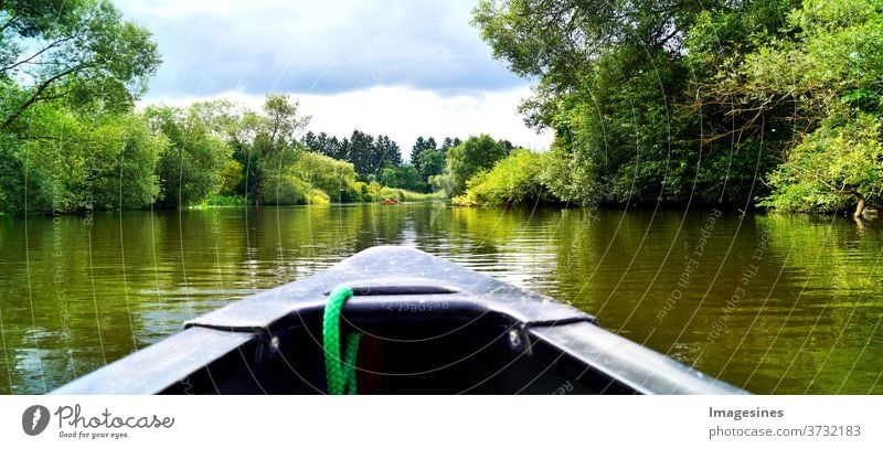 Canoeing through a river. Boat trip. Canoe on the river Lahn in Germany Adventure Beauty & Beauty Beauty in nature Blue boat canoeing Clouds in the sky