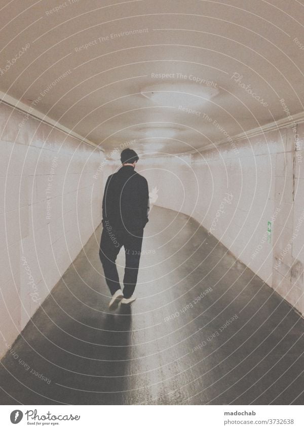 Upright walk Human being Man portrait Tunnel Subsoil Underpass Berlin Rear view Underground Light Train station Town Loneliness Tile Perspective Symmetry