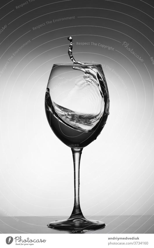 White wine splash on gray background. silhouette of a glass. selective focus drink white restaurant water object crystal liquid isolated thirsty beverage