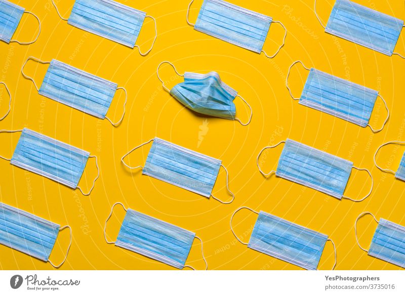 Medical masks isolated on a yellow background. Protective masks patterns above view air avoidance blue breath care clean concept corona coronavirus covid19