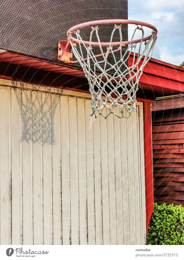 Basketball ring with net, shadow, fixed to a wall Day Deserted Exterior shot Colour photo Town Basketball basket Wall (building) Beautiful weather